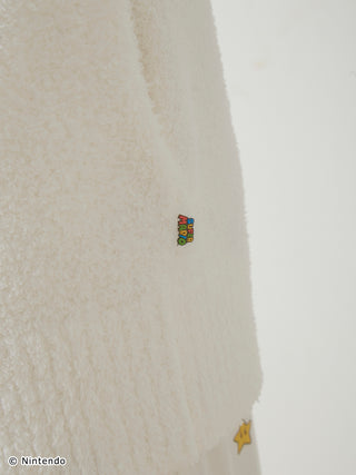 Detail of Super Mario Baby Moco Jacquard Shawl Cardigan featuring soft, fluffy material and colorful Super Mario logo embroidery.