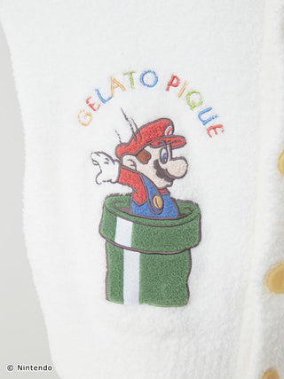 Detail of Super Mario embroidery on Baby Moco cardigan, showcasing Mario emerging from a green pipe, highlighting unique design.