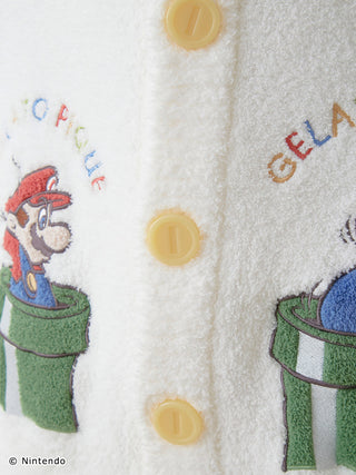 Close-up of Super Mario Baby Moco Jacquard Shawl Cardigan featuring Mario design and yellow buttons, made from soft and fluffy material.