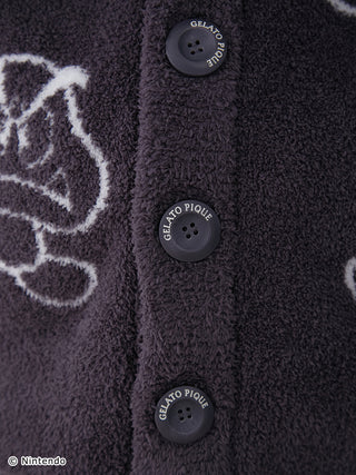 Close-up of Super Mario themed Baby Moco jacquard cardigan buttons, featuring soft, fluffy fabric with character patterns.