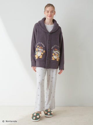 Model wearing the Super Mario™️ Unisex Baby Moco Jacquard Shawl Cardigan, soft and fluffy knitwear with Mario-themed design.