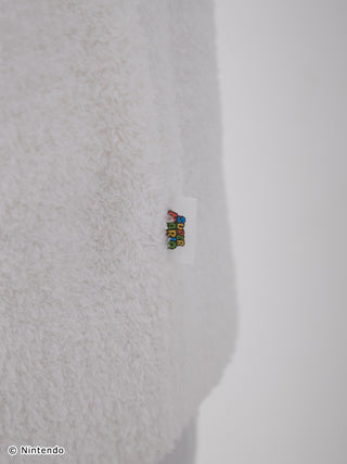 Close-up view of a soft, fluffy Baby Moco material on a Super Mario shawl cardigan.