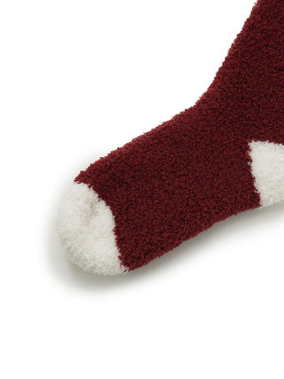 Chocolate & Framboise Baby Moco Fuzzy Socks in red and white, close-up view of toe area, showcasing plush texture for cozy comfort.