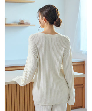 Woman wearing a white Thermal Smoothie Pullover Sweater with ribbed texture, perfect for cozy loungewear. Back view in a modern kitchen.