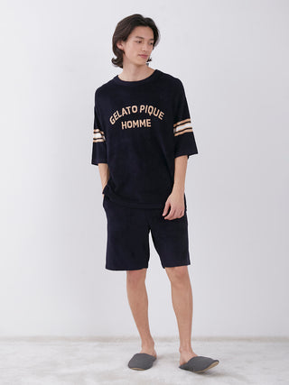 Man wearing Gelato Pique Homme loungewear set in dark color, featuring shorts and a matching top, stylish and comfortable ensemble.