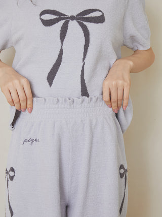 Woman wearing Ribbon Jacquard Lounge Shorts in blue with premium loungewear style, featuring Gelato Pique USA details.