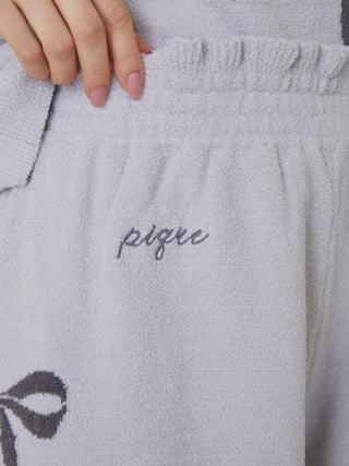 Close-up of off-white Ribbon Jacquard Lounge Shorts with embroidered logo, premium loungewear by Gelato Pique USA.