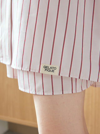 Close-up of Gelato Pique striped long sleeve pajama shirt hem with tag, showcasing relaxed and sophisticated sleepwear design.