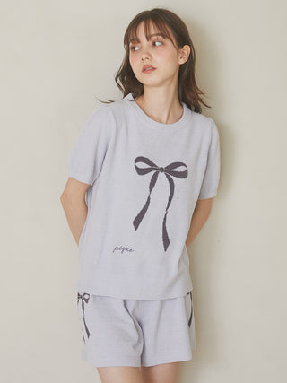Model wearing Gelato Pique USA Ribbon Jacquard Lounge Shorts set in blue, featuring premium loungewear with a ribbon motif design.