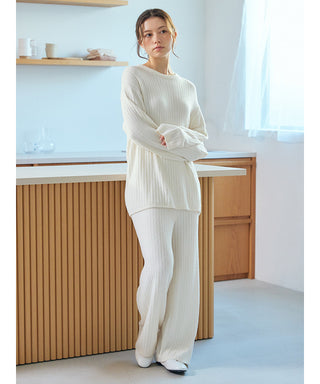 Woman wearing Thermal Smoothie Pullover Sweater, showcasing its ribbed texture and elegant design in a cozy home setting.