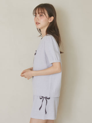 Woman wearing blue Ribbon Jacquard Lounge Shorts by Gelato Pique USA, featuring ribbon motif, premium loungewear.