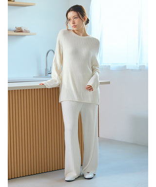 Woman wearing a Thermal Smoothie Pullover Sweater, showcasing soft loungewear with a ribbed texture in an elegant cream color.