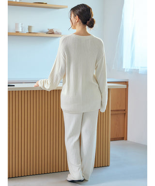 Woman wearing Gelato Pique USA's Thermal Smoothie Pullover Sweater in white, showcasing ribbed texture and elegant, cozy loungewear style.