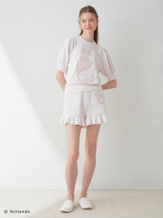 Model wearing Peach Collection Pullover & Shorts Set with puff sleeves, ruffles, and airy texture, designed for comfort and style.