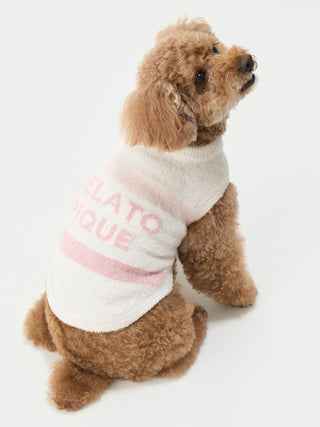 Dog wearing soft pink and white CAT&DOG Smoothie Cake Border Pet Clothes, showcasing comfort and elegance for special occasions.