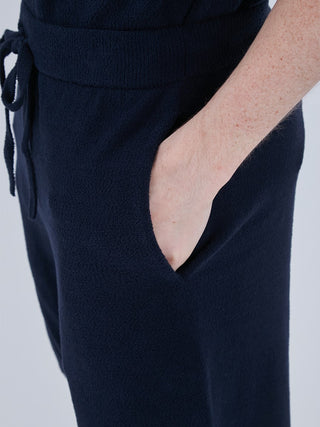 Close-up of Airmoco men's lounge shorts in navy, featuring a side pocket and drawstring waistband for comfort and style.