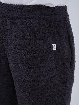 Baby Moco Men's Long Lounge Pants in black with textured 'Babymoco' material, featuring a cozy pocket and signature patch.