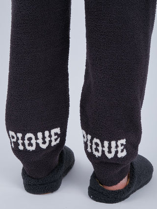 Back view of Baby Moco Men's Long Lounge Pants with 'Pique' lettering, showcasing the soft, luxurious texture of the exclusive material.