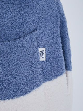 Close-up of Baby Moco Men's Long Lounge Pants fabric with Gelato Pique label, showcasing luxurious comfort and unique texture.