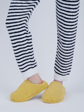 Men's striped lounge pants with cozy yellow slippers, featuring plush Baby Moco fabric and playful duck pattern.