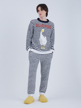 Model wearing Baby Moco Duck Stripe Men's Lounge Pants and sweater with duck design, showcasing quirky elegance and plush comfort.