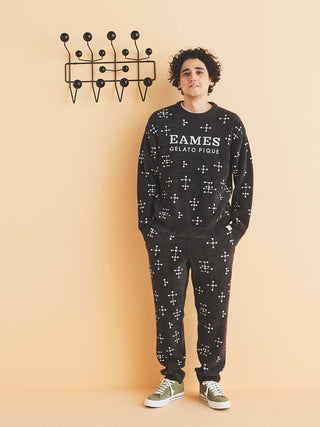 Man wearing EAMES MENS Smoothie Jacquard Fluffy Long Pants, featuring iconic dot pattern, part of Gelato Pique collaboration.