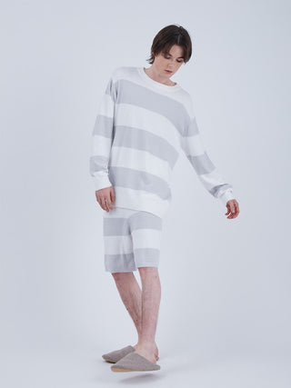 Model wearing Smoothie 2 Border Sweatshirt Pullover in white and bluish-gray, showcasing timeless comfort and loose fit style.