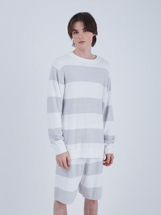 Model wearing Smoothie 2 Border Sweatshirt Pullover in white and bluish-gray stripes, showcasing a comfortable and stylish design.