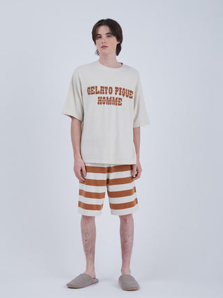 Model wearing Smoothie Logo Men's Shorts & Top Loungewear Set featuring striped shorts and a cozy top, perfect for summer lounging.