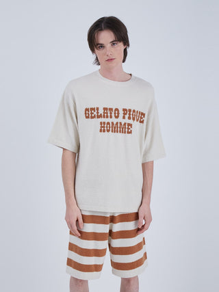 Model wearing a Smoothie Logo Men's Shorts & Top Set, featuring a cozy loungewear design with a summery striped pattern, perfect for warm days.