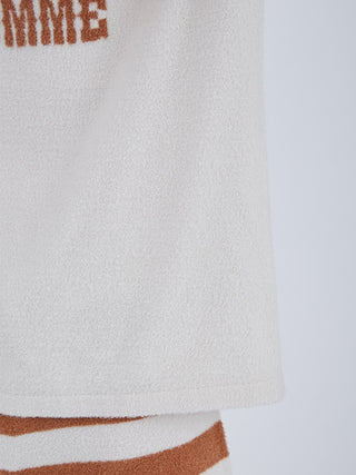 Close-up of white and brown Smoothie Logo Men’s Loungewear Set, showcasing soft textured fabric for luxurious spring-summer comfort.