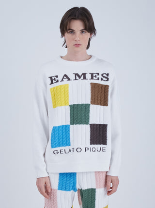 Model wearing EAMES Air Moco Logo Men's Knit Pullover with colorful squares and bold logo design, crafted from recycled polyester.