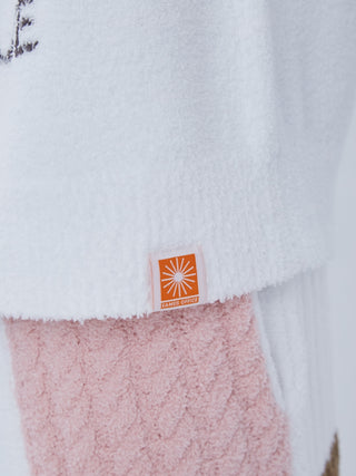 Close-up of EAMES Air Moco Logo Men's Knit Pullover, showcasing soft knit fabric and Jacquard logo detail with recycled polyester.