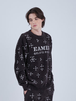 Model wearing EAMES MENS Smoothie Jacquard Pullover Sweatshirt with mid-century dot pattern, crafted from recycled polyester, in black.