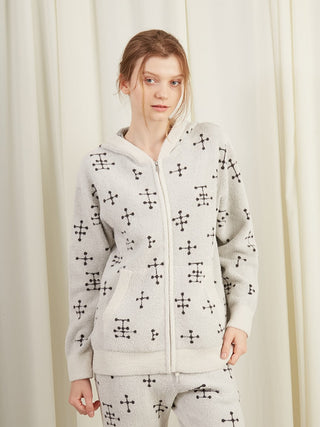 Woman wearing EAMES Smoothie Zip-Up Hoodie with mid-century dot pattern, showcasing cozy loungewear style.