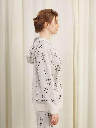 Side view of woman wearing EAMES Smoothie Zip Up Hoodie with mid-century dot pattern, displaying cozy and stylish loungewear design.