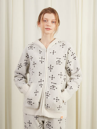 Woman wearing EAMES Smoothie Women's Zip Up Hoodie with dot pattern, showcasing cozy loungewear style in mid-century inspired design.