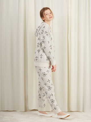 Woman wearing EAMES Smoothie Women's Zip Up Hoodie with dot pattern, showcasing cozy loungewear in vintage mid-century inspired design.