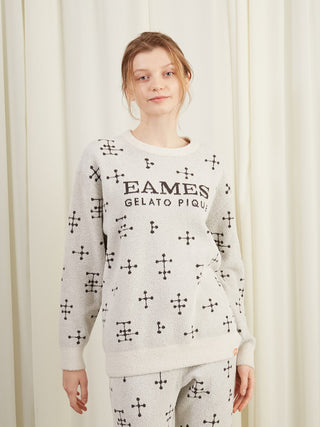 Woman wearing EAMES Gelato Pique cozy pullover sweater with iconic dot pattern and lightweight warmth