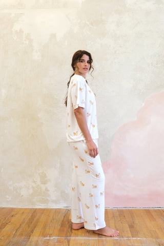 Woman wearing white Shiba Motif Lounge T-shirt and pants from Gelato Pique USA, premium loungewear and sleepwear collection.