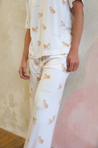 Model wearing cream Shiba Motif Lounge T-Shirt and pants by Gelato Pique USA, featuring playful Shiba Inu print. Premium loungewear and sleepwear.