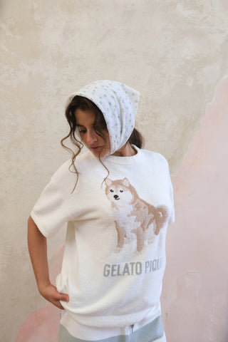 Model wearing a cream Shiba Inu pullover from Gelato Pique USA, paired with soft striped shorts. Premium loungewear and sleepwear.