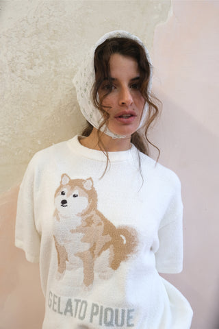 Woman wearing Gelato Pique USA white Shiba pullover, featuring Shiba Inu design, representing premium loungewear and sleepwear fashion.