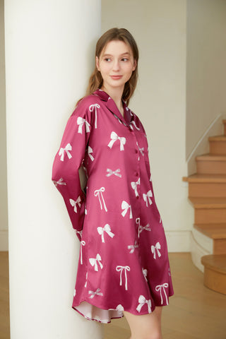 Model wearing Ribbon Pattern Satin Shirt Dress with bow print, showcasing elegant and comfortable loungewear style.