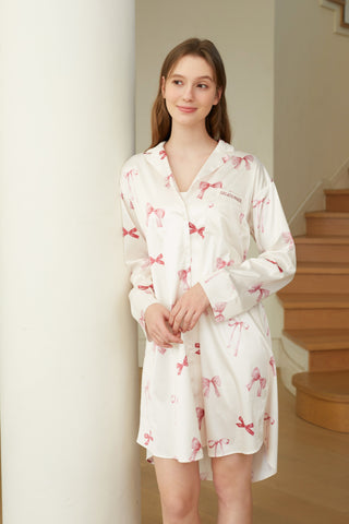 Model wearing Ribbon Pattern Satin Shirt Dress with bow print, showcasing elegant and comfortable loungewear in silky satin fabric.