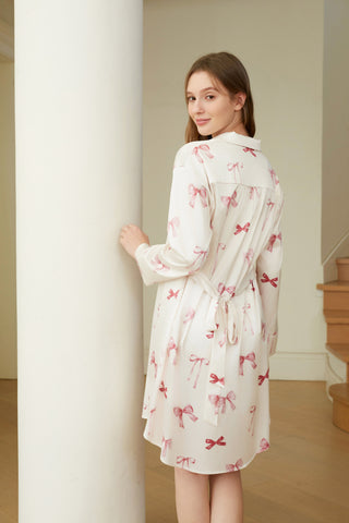 Back view of woman wearing Ribbon Pattern Satin Shirt Dress with pink bow design, showcasing elegant and comfortable loungewear style.