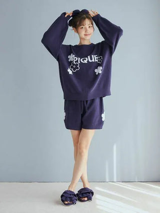 Model wearing Gelato Pique Airy Moco Flower Logo Jacquard Pullover Sweater, showcasing cozy and stylish lounge apparel.