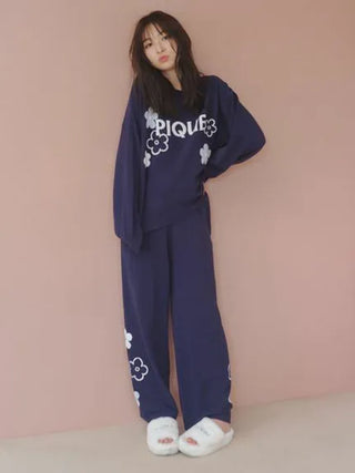 Model wearing Gelato Pique Airy Moco Flower Logo Jacquard Pullover Sweater, showcasing cozy and stylish lounge fashion.