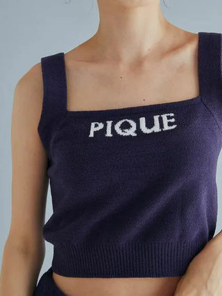 Woman wearing Gelato Pique navy Airy Moco cropped tank top with "PIQUE" logo.