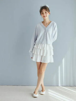 Woman wearing Airy Moco Tiered Mini Skirt by Gelato Pique, showcasing the lightweight, soft, and elegant design in a casual outfit.